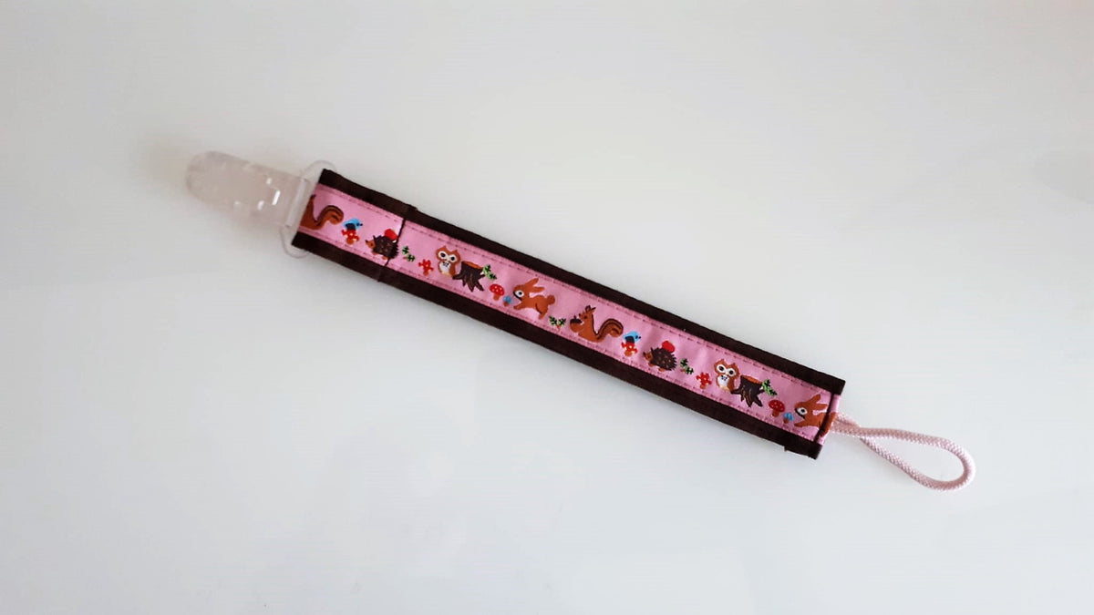 Nuggi-/Spielzeugband Waldtiere rosa